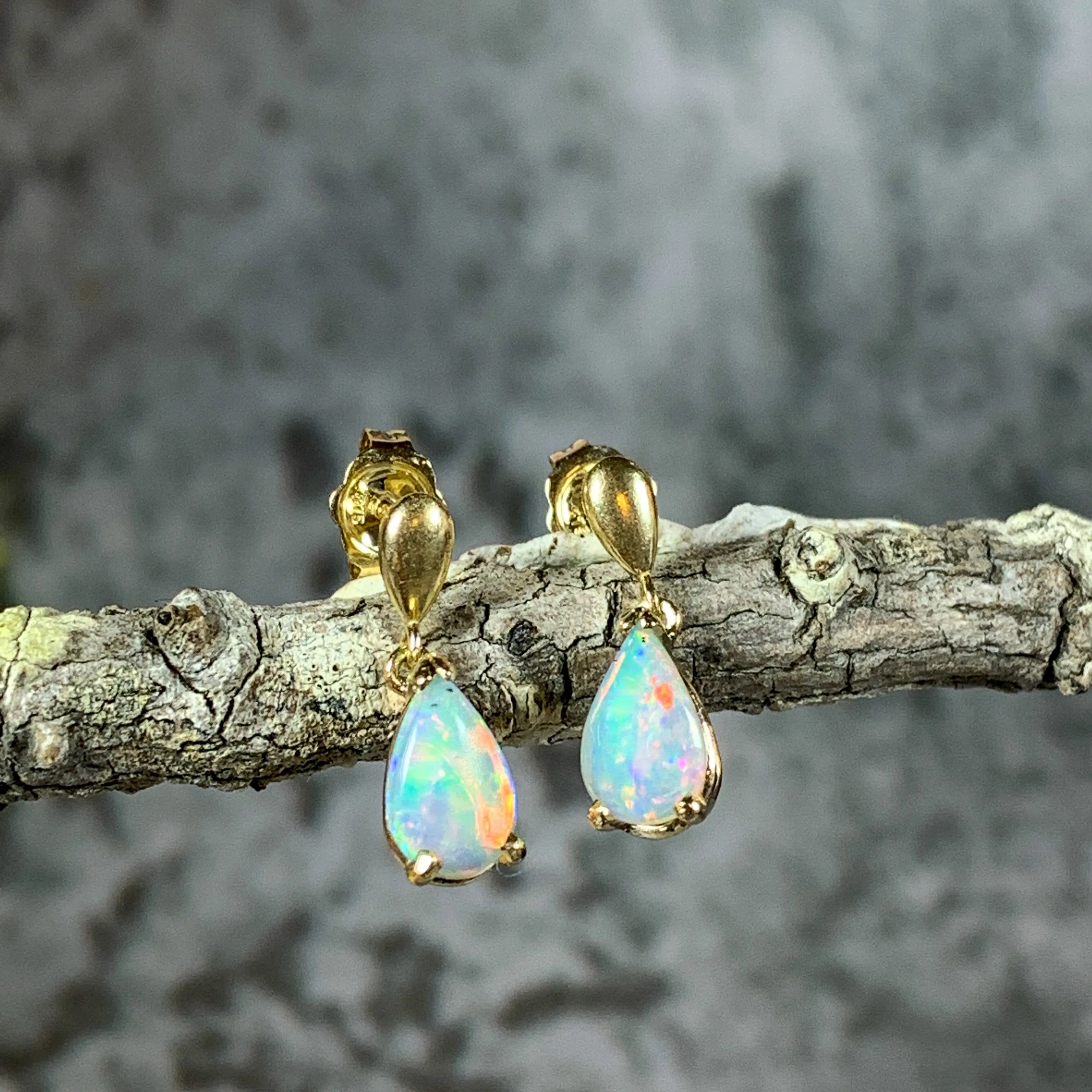 14kt Yellow Gold dangling pear shape 8x5mm Crystal Opal earrings